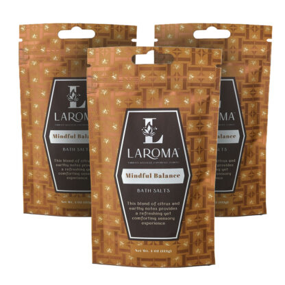 Three upright brown Laroma Mindful Balance bath salt pouches with geometric patterns and product labels, arranged in a triangle on a white background.