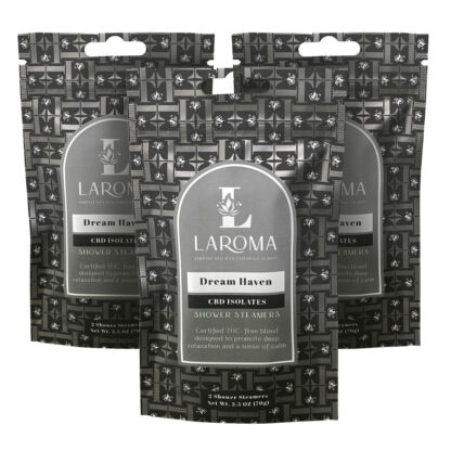 Three packages of Laroma Dream Haven CBD Isolates Shower Steamers are displayed, featuring a patterned black and gray design with white and silver labels and text highlighting relaxation and calm benefits.