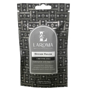 A black package of Dream Haven Shower Steamers (CBD Isolates) with a geometric flower pattern, promoting deep relaxation and calm. Each pack contains 2 shower steamers, totaling 2.5 oz.