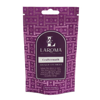 A purple pouch of Mindful Balance Shower Steamers (Copy) with a geometric pattern, brand logo, and product description on the front. The package contains two shower steamers with a total weight of 2.5 oz.